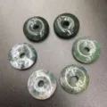 Detail view of 15mm natural moss agate donut beads with unique green patterns - 15mm / Moss Agate