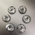 Macro view of 15mm natural grey speckled stone donut pendants for DIY jewelry crafts - 15mm / Flash Stone (Labradorite)