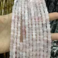 Close-up of 8x10mm pink natural stone bamboo-shaped beads for DIY jewelry crafting - Approx 32 Beads Per Strand / Rose Quartz