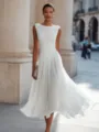 Detail view of elegant white sleeveless cowl neck midi dress in urban European street setting. - 3XL / White