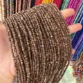 Close-up detail of 3mm natural brown shell heishi beads for DIY jewelry making - 3mm (Approx. 39cm Per Strand) / Dark Coffee