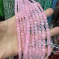 Dettaglio ravvicinato di perline in pietra naturale rosa a forma di cuore da 6mm per gioielli. - 6x2mm (Circa 60 Perle Per Filo) / Quarzo Rosa Naturale