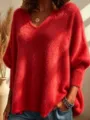 Close-up detail of the cozy red V-neck fluffy knit sweater showing soft textured fabric. - S / Red