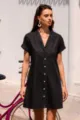 Detailed view of a stylish black lapel short-sleeved slim denim shirt dress for women. - S / Black