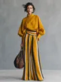 Elegant mustard yellow women's two-piece set featuring a long-sleeve top and striped wide-leg pants. - Yellow
