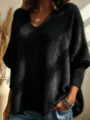 Detailed view of women's soft fuzzy V-neck knit long sleeve sweater in classic black tone. - Black
