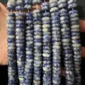 Macro detail of 4x10mm blue and white natural stone rondelle beads for jewelry making. - 50 Pieces/Pack / 4x10mm / Blue Spot Stone