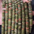Close-up of 4x10mm natural unakite stone rondelle spacer beads for DIY jewelry - 50 Pieces/Pack / 4x10mm / Unakite