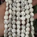 Close-up view of white howlite faceted round disc beads with natural grey marble textures for DIY - 8*8mm*5mm (Approx. 25 Pcs/Strand) / Natural White Turquoise