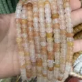 Macro detail of semi-translucent natural yellow quartz drum beads for DIY jewelry accessories - Pink Aventurine