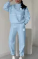 Women light blue half-zip sweatshirt sweatpants tracksuit set with white piping and M print. - Light Blue