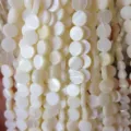 Macro detail of natural white round mother-of-pearl shell disc beads for DIY accessories - Round Disc (682) / 6mm Pack (Approx. 63 Pcs/Strand) / Natural Shell White