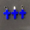 Detailed view of three natural lapis lazuli stone cross pendants for jewelry making - Royal Blue Jade