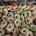 Close-up of 25mm natural Unakite stone donut pendants for DIY jewelry making - Unakite