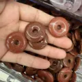Detailed view of 25mm brown goldstone donut beads for DIY jewelry making pendants - Gold Sandstone