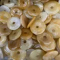 Macro detail of 25mm natural yellow agate donut beads for DIY jewelry making - Natural Topaz