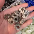 Macro view of natural stone off-center peace buckle beads for DIY jewelry accessories - Feldspar