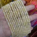 Close-up of pale yellow faceted square zircon beads for DIY jewelry making and craft projects - Yellow Zirconia
