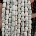Close-up of white turquoise barrel beads with natural grey marble texture for DIY jewelry - 10x14mm (Approx 28 Pcs/Strand) / White Howlite