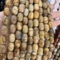 Macro shot of natural stone barrel beads for DIY jewelry making and bracelet crafts. - 10x14mm (Approx 28 Pcs/Strand) / Picture Jasper