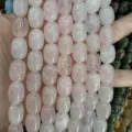 Close-up of natural rose quartz barrel beads with smooth polished finish for jewelry making - 10x14mm (Approx 28 Pcs/Strand) / Rose Quartz