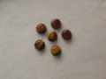 Close-up of natural tiger's eye round cabochons with flat back for DIY jewelry making - 4mm Size / Natural Tiger Eye