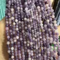 Detailed view of faceted purple natural stone beads for DIY necklace and bracelet jewelry making - Natural Lilac Stone Round Beads / 2mm Faceted (Approx. 170 Beads/Strand)