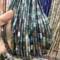 Close-up of 4x9mm multi-colored natural stone cylinder beads for jewelry making - Rectangle Strip (Length 38cm) / India Agate