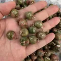 Macro view of apple-shaped natural unakite stone pendants for DIY jewelry - 15mm (ai-10 Pieces/Pack) / Unakite