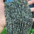 Detailed macro shot of faceted natural African Turquoise round beads for DIY jewelry making - 2mm Strand (Approx 150 Beads) / African Pine