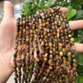 Close-up of irregular tiger eye stone beads for DIY jewelry making - Tiger Eye
