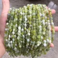 Detailed view of 4x6mm green irregular natural stone beads for DIY jewelry making crafts - Translucent Southern Jade