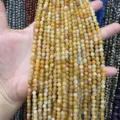Gros plan de perles en pierre naturelle facettée jaune de 4mm pour bijoux DIY - Perle Ronde Facettée Triangulaire / 4mm (Environ 90 Pièces/Fil) / Jade Jaune Naturel