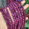 Nahaufnahme von violetten ovalen Turmalin-Achat-Steinperlen für DIY-Schmuckherstellung - Ca. 6*9mm (Ca. 38cm Strang) / Pflaumenviolett
