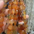 Gros plan de perles en forme de croix en agate orange pour la création de bijoux DIY. - 12x12x6mm (Environ 17 Pièces/Paquet) / Agate rouge