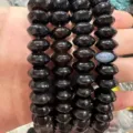 Detailed close-up of translucent black natural stone saucer beads for jewelry making - 5*8mm (Approx 40 Pieces/Strand) / Black Agate