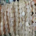Close-up detail of natural white agate faceted waterdrop beads for jewelry DIY projects - Agate
