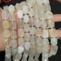 Macro view of faceted octagonal natural milky agate stone beads for DIY jewelry making projects - Agate