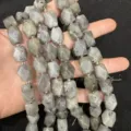 Close-up of faceted octagonal natural stone beads for DIY jewelry making accessories - Labradorite