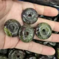 Detail view of 25mm natural stone donut pendants for DIY jewelry making accessories - African Bloodstone