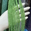 Close-up of 3mm faceted green cat's eye beads for DIY jewelry making - 3mm (Approx 120 Beads/Strand) / Green