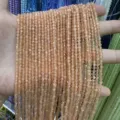 Detailed close-up view of 3mm faceted peach cat's eye round beads for DIY jewelry making material - 3mm (Approx 120 Beads/Strand) / Light Orange