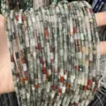 Macro view showing detail of 3x6mm cylindrical natural stone beads in mixed colors - 3*6mm (Approx. 60 Beads Per Strand) / Dragon Blood Stone