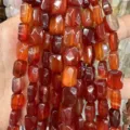 Macro detail of high-quality natural red carnelian agate faceted rectangle beads for DIY - Red Agate