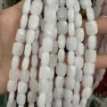 Macro view of natural white stone faceted rectangular loose beads for DIY jewelry making - White Jade
