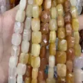 Close-up of faceted rectangular natural stone beads in varied earthy colors for DIY jewelry - Topaz