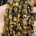 Close-up view of faceted natural Tiger's Eye rectangular loose beads for DIY jewelry making - Tiger Eye
