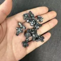 Macro detail of 12x16mm snowflake obsidian cross beads for DIY jewelry making - Approx 12*16mm / 1 Bead / Snowflake