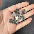 Detailed view of 12x16mm black and white marble stone cross beads with vertical holes - Approx 12*16mm / 1 Bead / Black Network Stone