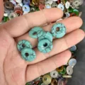 Turquoise-colored stone donut beads with black veins for DIY jewelry making - Turquoise